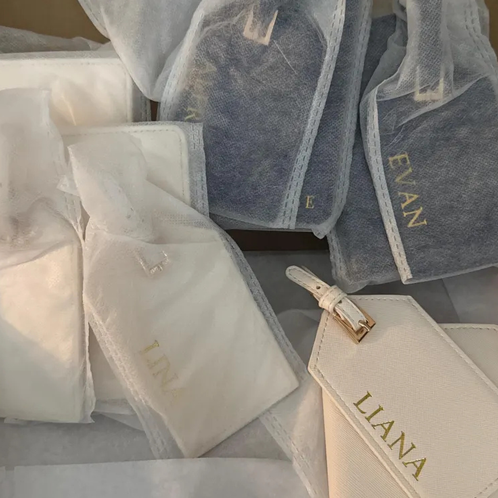 Customer photo of personalized luggage tags and passport cover, gift-wrapped